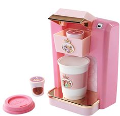 a pink toy coffee maker with two cups