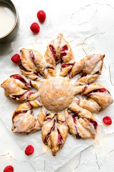 raspberry scones arranged in the shape of a flower with icing on top