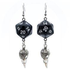 For Raven Queen worshippers who don't want to wear our huge and heavy (but very cool) raven earrings, we also offer this smaller, lighter (but still very cool) version. Each has a pearl black D20. Beneath the dice hang silvery raven skull charms. These would be a perfect accessory for someone playing a member of the shadar-kai or a cleric that worships the Raven Queen. A great gift for players of D&D, Pathfinder, and other tabletop RPGs -- or for anyone who wants to geek out with a fun and myste Black Skull Earrings For Gift, Adjustable Black Skull Earrings, Adjustable Black Skull-shaped Earrings, Black Novelty Drop Earrings, Black Fantasy Style Earrings, Black Fantasy Earrings, Black Fantasy Style Pierced Earrings, Nickel Free Black Skull Earrings, Black Fantasy Dangle Jewelry