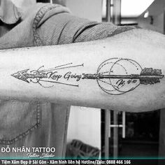 a man's arm with an arrow and the words keep going on it