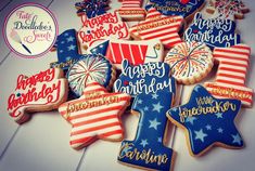 decorated cookies are arranged on a table for a fourth of july birthday cake topper