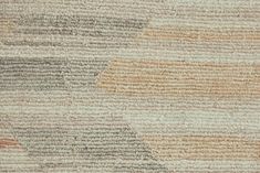 an area rug with different colors and textures