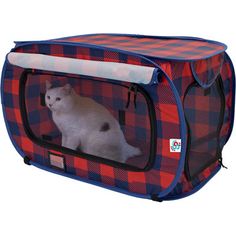 a cat in a red and blue checkered pet carrier with the door open to show it's inside