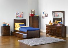 a bedroom scene with focus on the bed, dressers and other furniture in the room