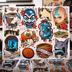 an assortment of stickers on top of a refrigerator