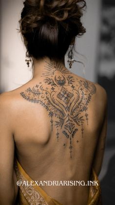 a woman with a tattoo on her back