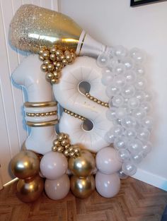 a bunch of balloons that are sitting on the floor next to a hair dryer