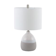 a lamp with a white shade on it