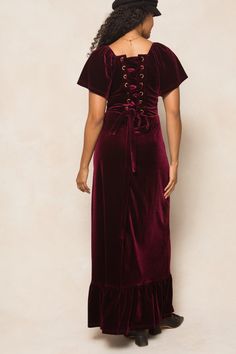 Dress to impress in our Maddie Dress. This stunning maxi-length dress features a wine velvet fabric and a square neckline with short flutter sleeves. The lace-up corset detailing on the back adds a touch of sass, while the hidden back zipper ensures a seamless silhouette. With a lined bodice and stretch fabric, this women's dress combines comfort and style. Corset Boning, City Woman, Square Necklines, Fabric Squares, Flutter Sleeve, Velvet Fabric, Dress Length, Stretch Fabric, Bodice