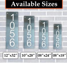 four metal numbers are displayed on a brick wall, with the words available sizes below them