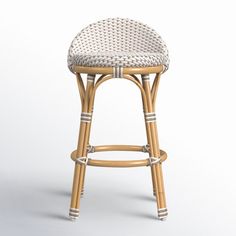 a wicker bar stool with an upholstered seat and backrest, viewed from the front