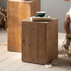 two wooden stools sitting next to each other on top of a hard wood floor