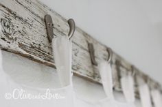 an old door is hanging on the side of a wall with some toilet paper in it