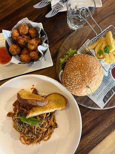 a table topped with plates of food and drinks