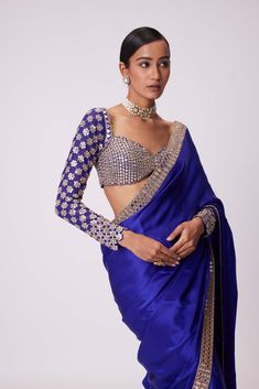 Elevate elegance with the persian blue satin sari, featuring intricate hand embroidery along the border. Paired with a stunning full-sleeve blouse boasting exquisite hand-cut mirror work, this ensemble is a timeless masterpiece of craftsmanship and style. Unique Saree Blouse Designs, Full Sleeves Embroidered Blouse, Wedding Party Look Indian, Full Sleeves Blouse With Saree, Full Selves Blouse For Saree, Full Blouse Designs Saree, Western Blouse Designs For Saree, Blouse Designs Satin, Saree With Sleeves