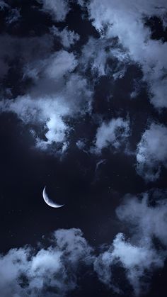 the moon is in the sky with clouds around it