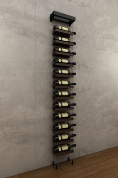 a wine rack with many bottles in it on the wall next to a wooden floor