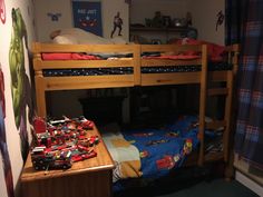 there is a bunk bed with toy cars on it