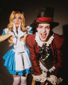 two people dressed up as alice and the mad hatter are posing for a photo