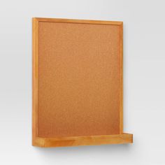 an empty cork board mounted on a wall