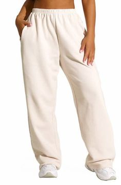 These high-rise elastic-waist sweatpants made from comfy cotton-blend fleece are ones you'll reach for each time lounge day comes around. 33" length (size Small) Elastic waist Side-seam pockets 80% cotton, 20% polyester Hand wash, line dry Imported Oversized Sweatpants With Ribbed Waistband For Lounging, Baggy Sporty Sweats For Loungewear, Oversized Comfortable Joggers For Loungewear, Oversized Comfortable Joggers With Ribbed Waistband, Comfortable Oversized Joggers With Ribbed Waistband, Oversized Athleisure Joggers For Lounging, Comfy Oversized Sweatpants For Lounging, Oversized Joggers With Elastic Cuffs For Loungewear, Oversized Sweats With Elastic Waistband For Loungewear