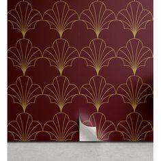 an art deco wallpaper design with gold scallops on a maroon and white background