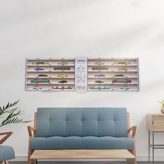 a blue couch sitting next to a wooden table on top of a hard wood floor