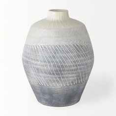 A smooth vase with cream and blue-grays ombre color blocks that have a unique glossy white dimensional line pattern that changes direction with each shade. ;A smooth vase with creams and blue-grays that have a unique glossy white line pattern that changes direction with each shade. Feature 1: Dimensions: 8.3L x 8.3W x 10.2H Feature 2: Unique Pattern: The unique glossy white 3D line pattern lays over the different color blocks. Feature 3: Soft Neutrals: The soft, serene color palette Length (in): Table Vase, Mirror Wall Art, Table Vases, Ombre Color, Vase Set, Line Patterns, Ceramic Table, House Of Hampton, Glossy White