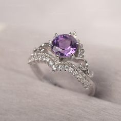 * The delicate ring displays amethyst as main stone. The curved band beneath the gemstone makes the ring like an elegant crown. For who wearing this dainty ring, will shine like a queen. ◆ Production Description: Main stone Type: Amethyst Main Stone Shape: Round Cut Main Stone Size: 7*7mm Side stone: CZ Metal: 925 Sterling silver - Other options available in the drop down menu ◆ Customization: √Free for Add Engraving √Other Metal Type Available √Other Gemstones & Shapes Available √Personaliz Luxury Amethyst Ring With Accent Stones For Promise, Elegant Lavender Amethyst Ring Luxury, Elegant Amethyst Crystal Ring With Center Stone, Elegant Amethyst Crystal Ring With Accent Stones, Elegant Amethyst Birthstone Crystal Ring, Elegant Amethyst Wedding Ring, Elegant Wedding Amethyst Ring, Elegant Amethyst Crystal Ring With Prong Setting, Elegant Purple Crystal Ring With Accent Stones