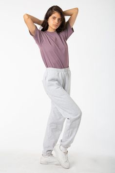 Made from a luxurious 14oz fleece, this sweatpants is incredibly soft and warm, yet still breathable and moisture-wicking. The relaxed fit allows for a full range of motion, making it perfect for lounging around the house, running errands, or hitting the gym. This sweatpant is Piece Dyed. Our piece-dyed sweatpants fabric is dyed before they're cut and sewn, which results in a more uniform color distribution throughout. This means you'll get pants with a cleaner, sharper look, without any color v Los Angeles Apparel, Garment Manufacturing, One Piece Clothing, Blue Ivy, Fleece Sweatpants, Fleece Pants, Wide Pants, Range Of Motion, Navy Color