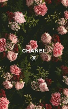 the chanel logo surrounded by pink and red flowers