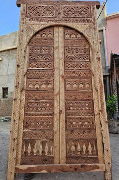 an old wooden door with intricate carvings on it