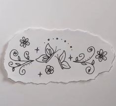 a piece of paper with flowers and butterflies on it