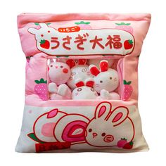 a pink bag filled with stuffed animals on top of a white background and japanese writing