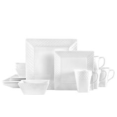 a white dinnerware set with cups and saucers on the side, in front of a white background