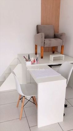 a white desk and chair in a room