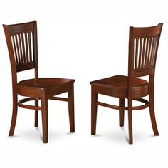 two wooden chairs sitting next to each other