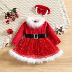 Dress your little one in festive elegance with our Red Christmas Santa Claus Dress. This dress is designed to make her shine during the holiday season, with a range of unique features and benefits. The dress boasts a classic Christmas red color, adorned with star sequins for a touch of sparkle. The crewneck and long sleeves provide warmth and comfort, perfect for the winter festivities. The neck back button closure allows for easy dressing, and the elastic waist ensures a snug and comfortable fi Christmas Outfit Kids, Girls Santa Dress, Santa Claus Dress, Red Christmas Outfit, Red Tulle Dress, Tutu Party, Santa Dress, Girl Red Dress