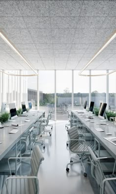 an empty conference room with desks and chairs