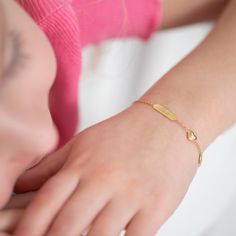 This 14k gold bracelet is a precious keepsake for any little girl. The small puffed heart charm adds a touch of elegance and sentimentality to this already stunning piece. Measuring at 5 inches, it is perfect for little wrists, and can be extended up to 6 inches to accommodate growth. The bracelet can also be engraved with a personalized message, making it a one of a kind gift for a special occasion or just because. This bracelet is sure to become a treasured piece for years to come, serving as a reminder of love and affection. Gift Box included with purchase. Age Group: Sweet Gifts For Babies, Toddlers & Little Girls; Safe for Sensitive Skin Material: 14k Yellow Gold Bracelet Length: 5 inches with 1" Extension; Tag: 14mm W x 4mm H Charm Size: 7mm W x 7mm H Heart Metal Stamp: 14k Gift Box Toddler Bracelet, Kids Bracelet, Kids Bracelets, Puffed Heart, Yellow Gold Bracelet, Sweet Gifts, Engraved Items, Toddler Kids, Metal Stamping