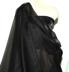 a black dress on a mannequin head