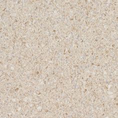 a close up view of a beige granite surface