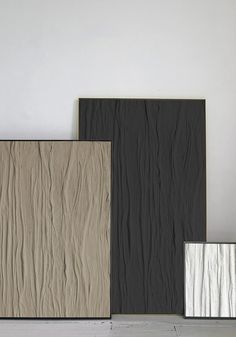 three different types of wall coverings in various colors and sizes, one is black, the other beige