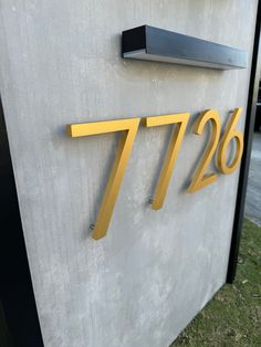 a house number sign on the side of a building