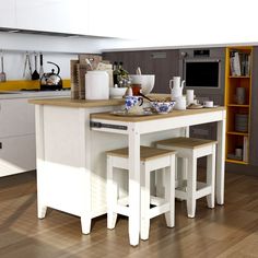 a kitchen island with two stools next to it and an oven in the background