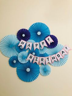 blue fan shaped paper fans with the words happy birthday on them