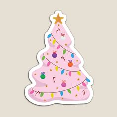 a pink christmas tree sticker with candy canes and candies on the top