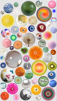 many different colored glass objects are arranged in the shape of circles and dots on a white background