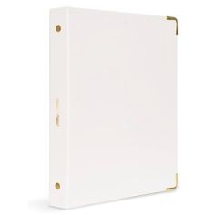 a white binder with gold trim