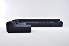 a black couch and ottoman on a white background